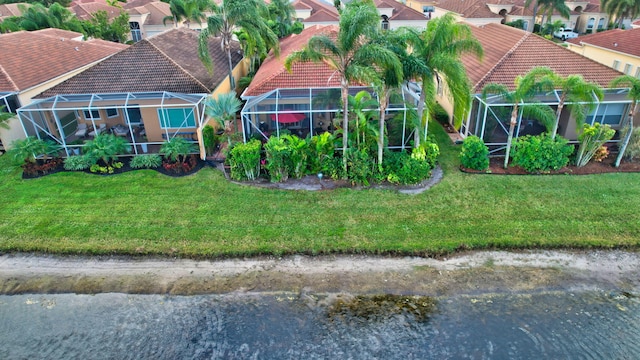 drone / aerial view with a water view