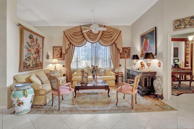 living area with ceiling fan and light tile patterned flooring