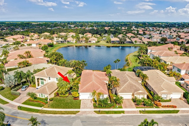 birds eye view of property with a water view