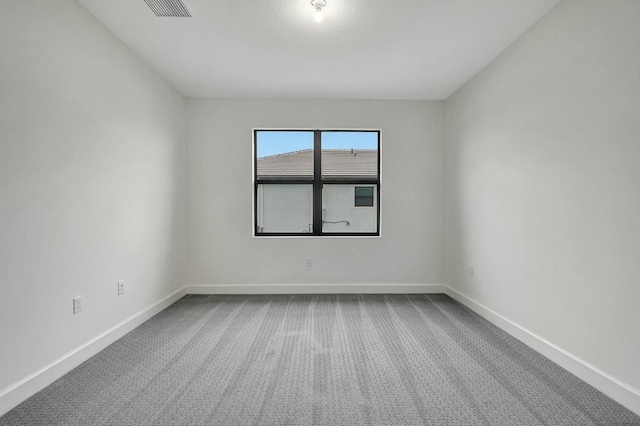 unfurnished room with carpet floors