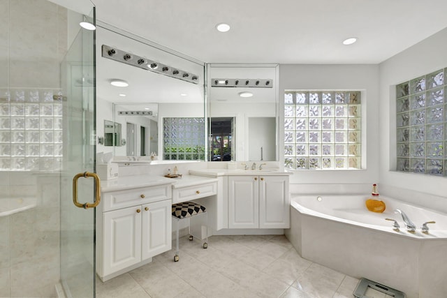 bathroom featuring separate shower and tub, tile patterned floors, and vanity