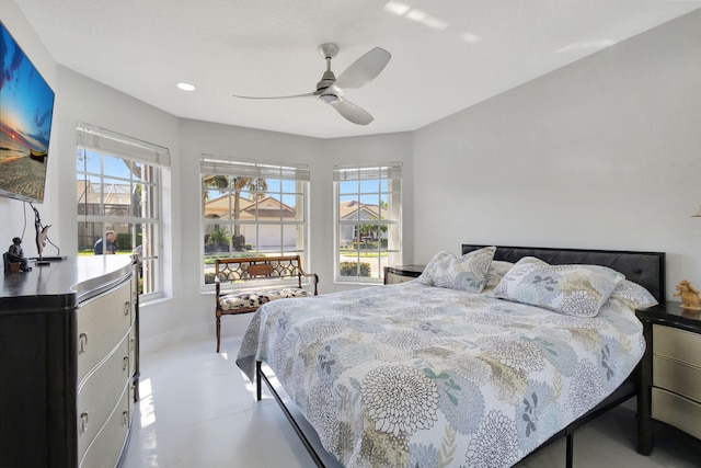 bedroom with multiple windows and ceiling fan