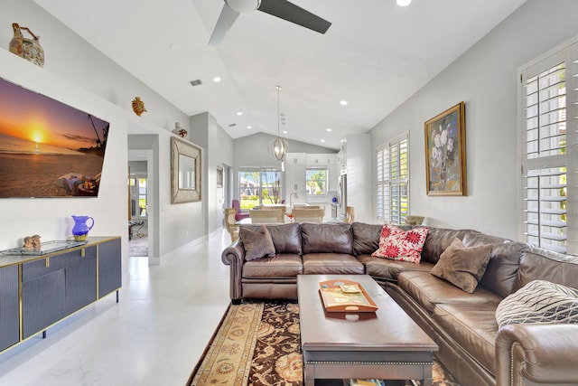 living room featuring ceiling fan and lofted ceiling