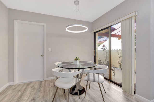 dining area featuring light wood-type flooring