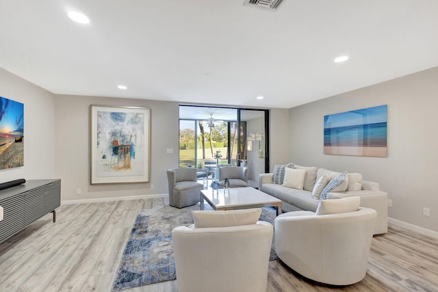 living room with light hardwood / wood-style floors