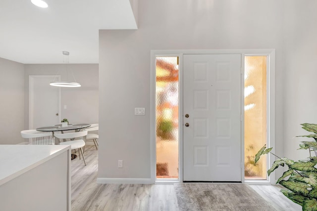 foyer with light wood-type flooring