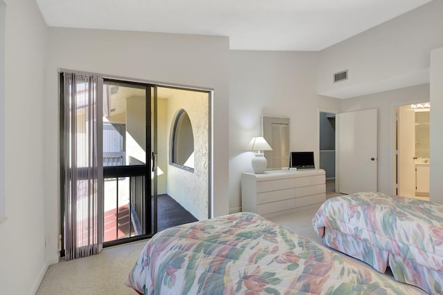 bedroom with vaulted ceiling, light carpet, and multiple windows