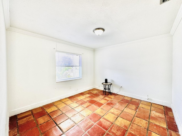 unfurnished room featuring ornamental molding and a textured ceiling