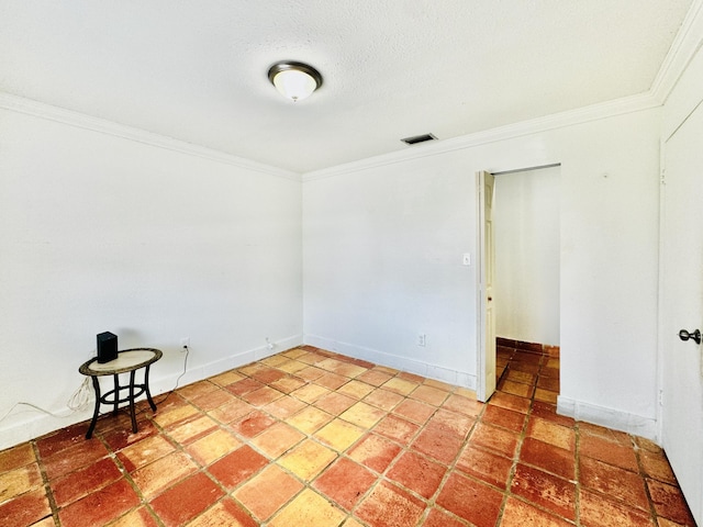 spare room featuring ornamental molding