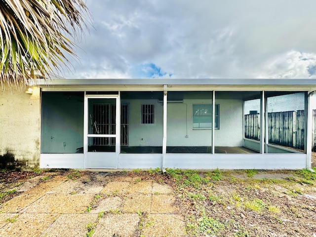 4952 Pimlico Ct, West Palm Beach, FL 33415 - back of property with a sunroom and stucco siding