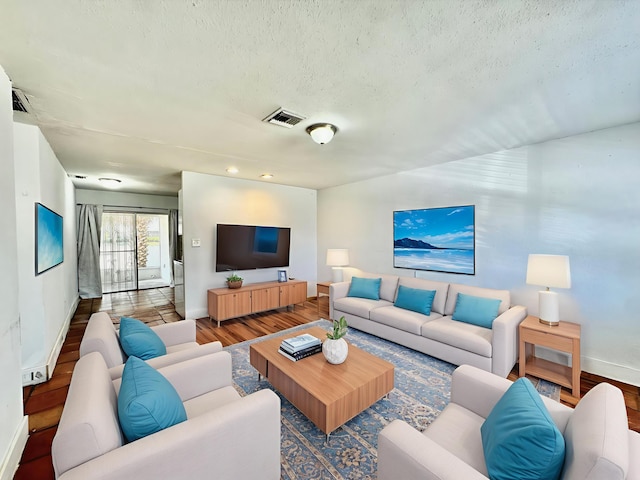 4952 Pimlico Ct, West Palm Beach, FL 33415 - living room featuring a textured ceiling and wood finished floors