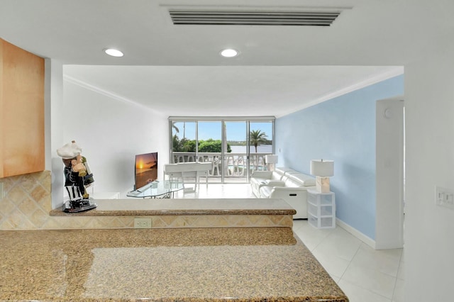 interior space featuring ornamental molding, recessed lighting, visible vents, and baseboards