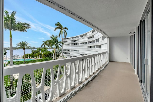 balcony featuring a water view