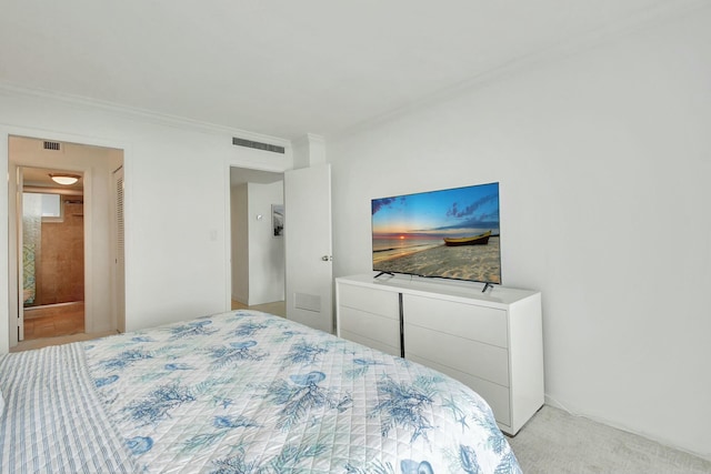 bedroom with light carpet and ornamental molding