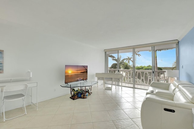 living room with light tile patterned floors and expansive windows