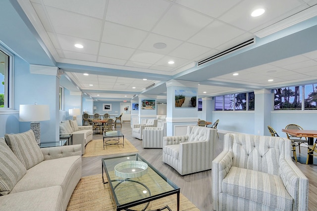 2505 S Ocean Blvd Unit 402, Palm Beach, FL 33480 - living area with plenty of natural light, light wood-type flooring, visible vents, and decorative columns