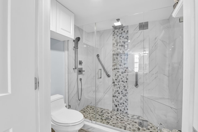 bathroom with walk in shower and toilet