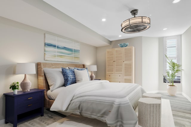 bedroom with a closet and light hardwood / wood-style flooring