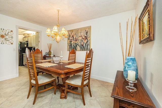 dining space with light tile patterned floors, a textured ceiling, and an inviting chandelier