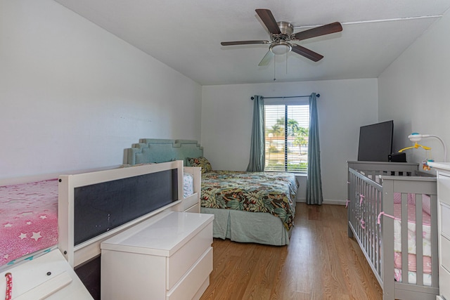 bedroom featuring ceiling fan and wood finished floors