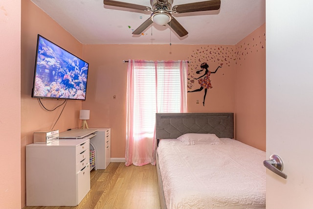 bedroom featuring light wood finished floors and ceiling fan