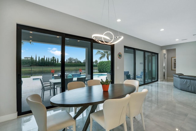 dining area featuring a chandelier