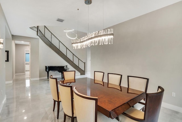 dining space with an inviting chandelier