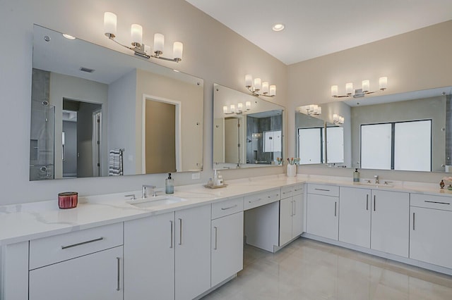 bathroom with tile patterned flooring and vanity