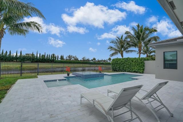 view of swimming pool with pool water feature, a patio, and an in ground hot tub