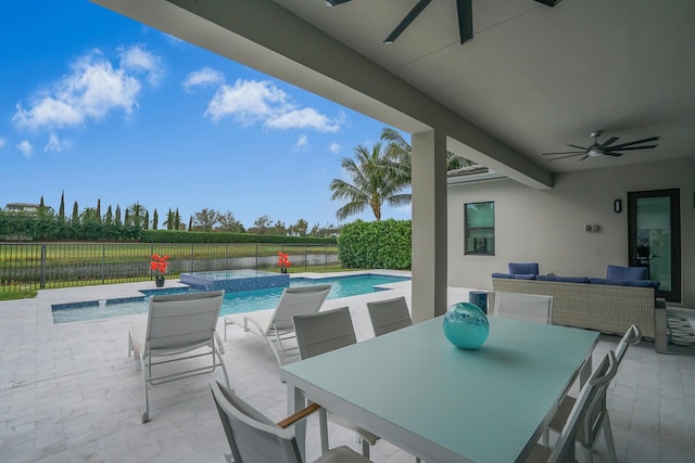 view of patio / terrace featuring ceiling fan, outdoor lounge area, and a fenced in pool