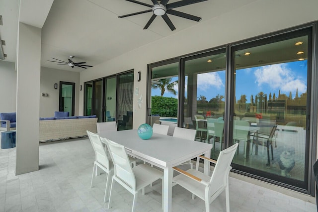 view of patio with ceiling fan and an outdoor living space