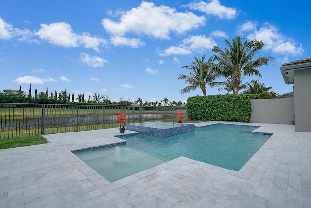 view of pool with an in ground hot tub and a patio