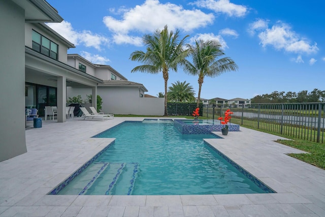 view of pool featuring an in ground hot tub and a patio