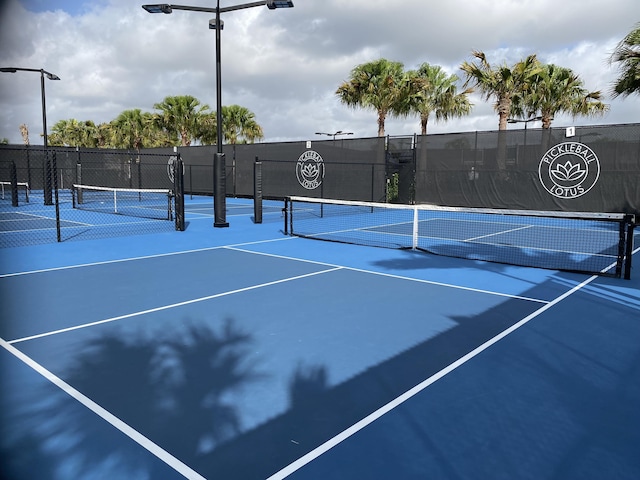 view of tennis court with basketball court