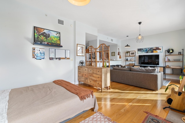 bedroom with light hardwood / wood-style floors