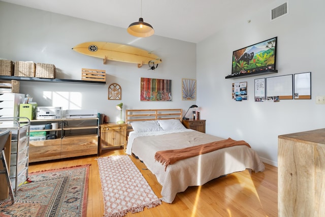 bedroom with light hardwood / wood-style floors