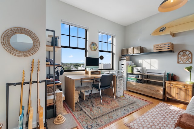 office space with light wood-type flooring