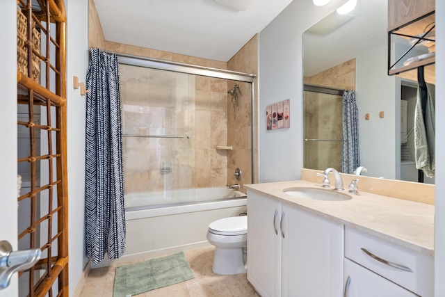 full bathroom featuring tile patterned flooring, vanity, toilet, and tiled shower / bath