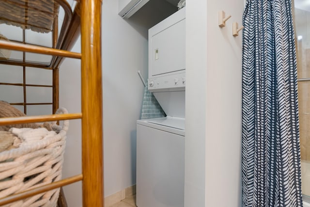 laundry room with stacked washer and dryer