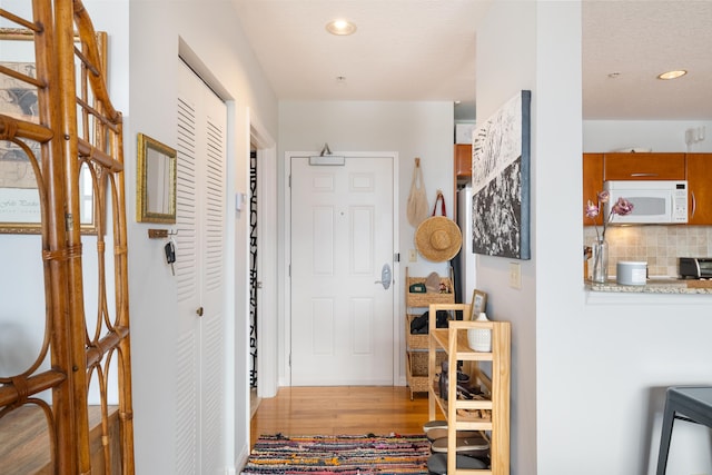 hall featuring light wood-type flooring