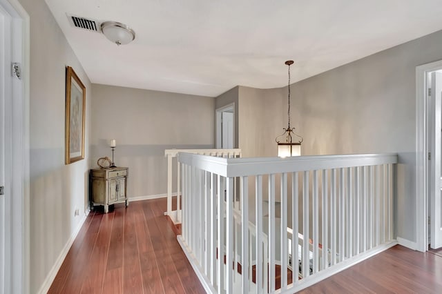 hallway featuring dark hardwood / wood-style flooring