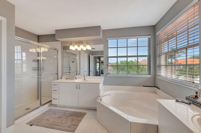 bathroom featuring tile patterned flooring, vanity, and separate shower and tub