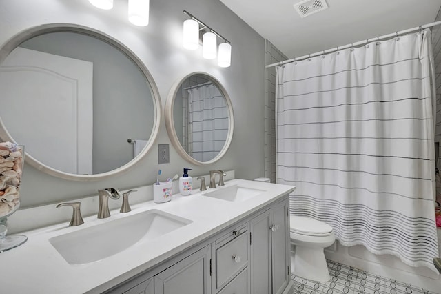 full bathroom with shower / bathtub combination with curtain, tile patterned flooring, vanity, and toilet