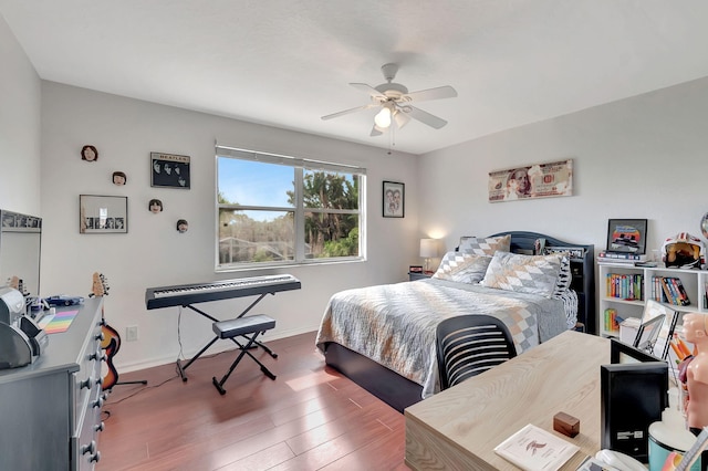 bedroom with ceiling fan and wood-type flooring