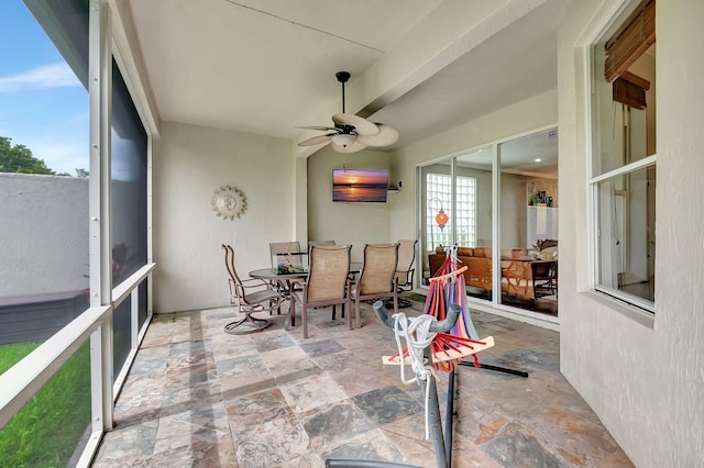 sunroom / solarium with ceiling fan