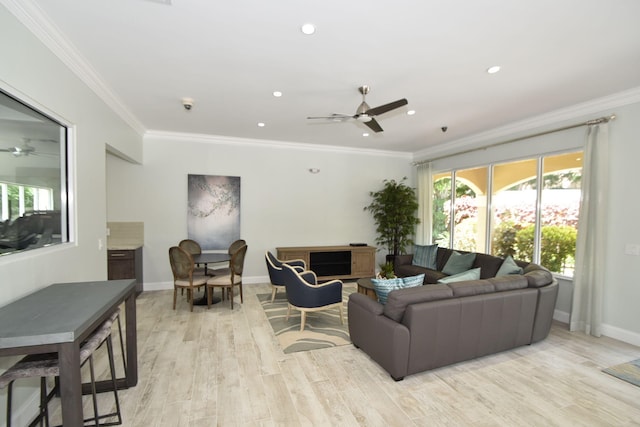 living room with ceiling fan, light hardwood / wood-style floors, and ornamental molding