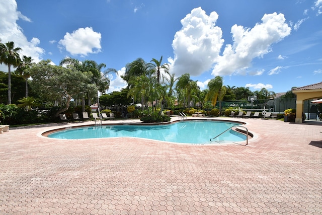 view of swimming pool with a patio