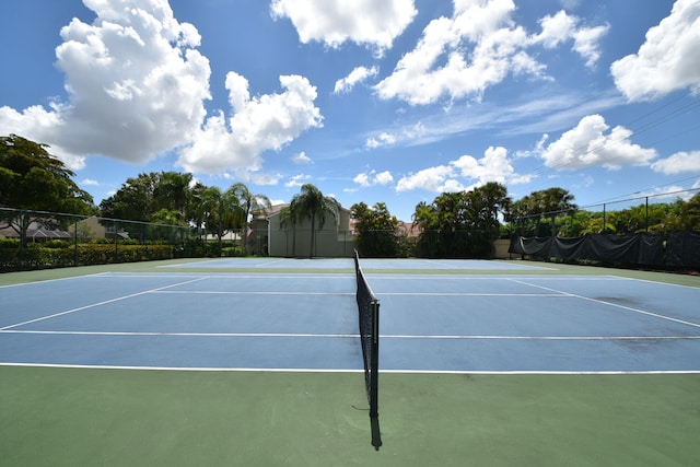 view of tennis court featuring basketball court