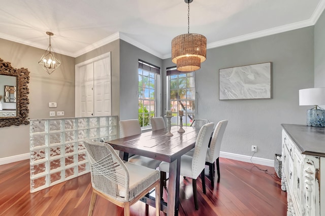 dining area with a chandelier, dark hardwood / wood-style floors, and ornamental molding