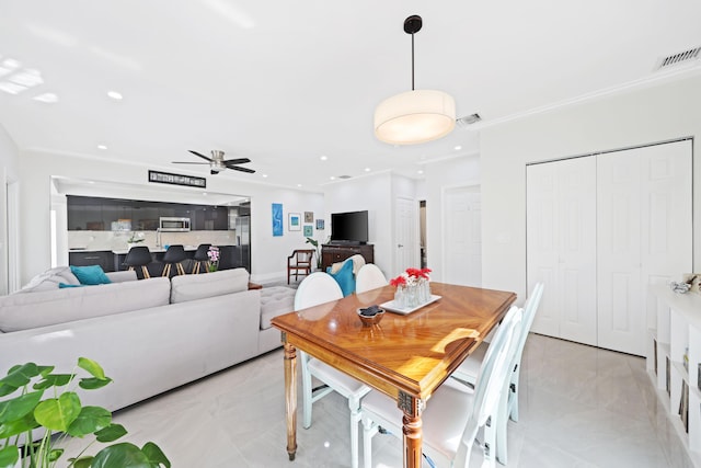 dining area with ceiling fan